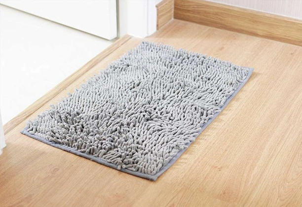 Bathroom Door Mats with absorbent surface texture placed near bathroom entrance for moisture control use