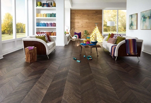 Chevron Parquet Flooring installed in a modern living room with natural wood finish and seamless plank alignment for interiors