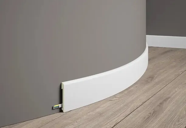 Flexible Baseboards Wall skirting installed along a living room wall with smooth corner finish and clean floor transition
