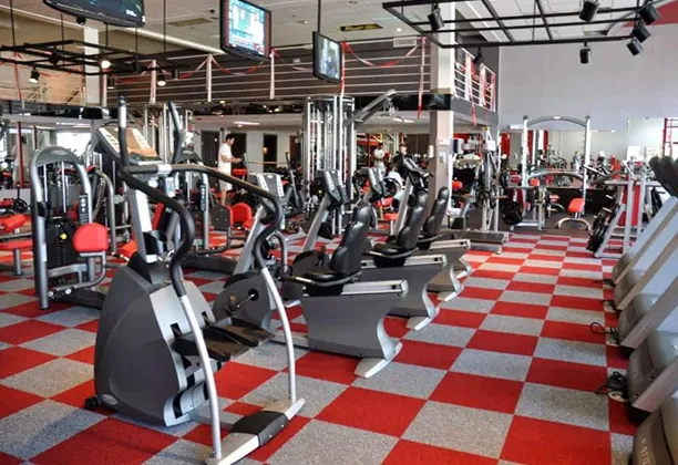Gym Carpet Tile installed across a commercial fitness studio floor with interlocking modular squares and clean edges