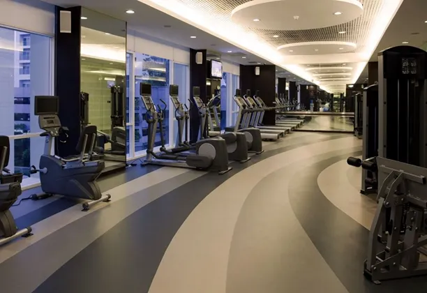 Gym Flooring Dubai installed with interlocking rubber tiles in a commercial fitness center for durable training surfaces