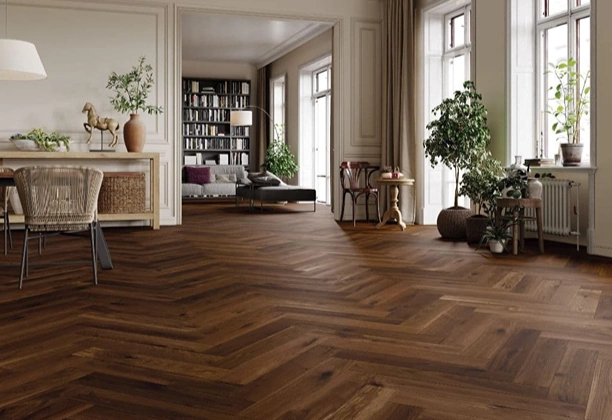 Herringbone Parquet Flooring installed in a modern living room with natural oak finish and angled wood plank pattern