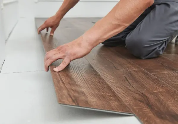 Laminate Flooring Dubai Installation process with floor preparation, measuring, and plank placement