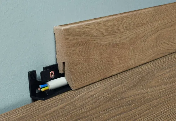 MDF Wall Skirting Boards with smooth painted finish installed along a modern living room wall and wood flooring