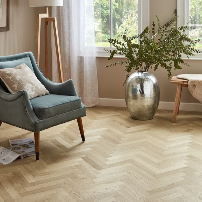 Parquet Wood Flooring installer placing patterned pieces with accurate floor alignment