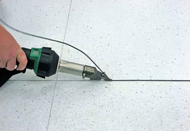 Pvc Welding Rods measured and trimmed before heat welding on commercial vinyl flooring