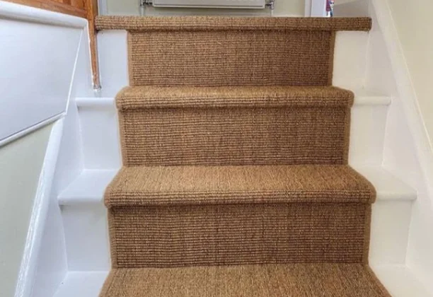 Sisal Stair Carpet covering hallway stairs with matching floor design