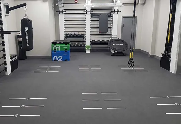 Special Gym Flooring interlocking rubber tiles installed in a commercial fitness area with shock-absorbing surface finish