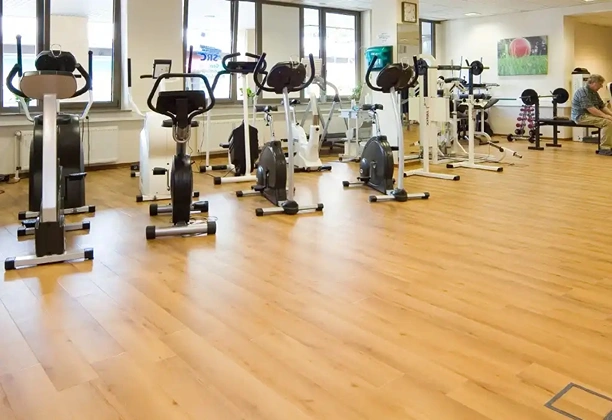 Vinyl Gym Flooring installed across a fitness training area with slip-resistant surface and durable finish for daily use