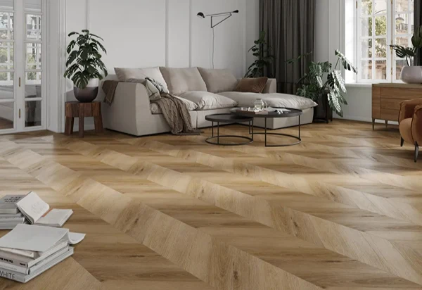 Wood look chevron SPC flooring featuring natural grain details and a contemporary pattern for stylish home and office interiors.